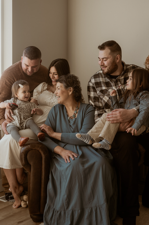 Grandmother sitting with children and grandchildren