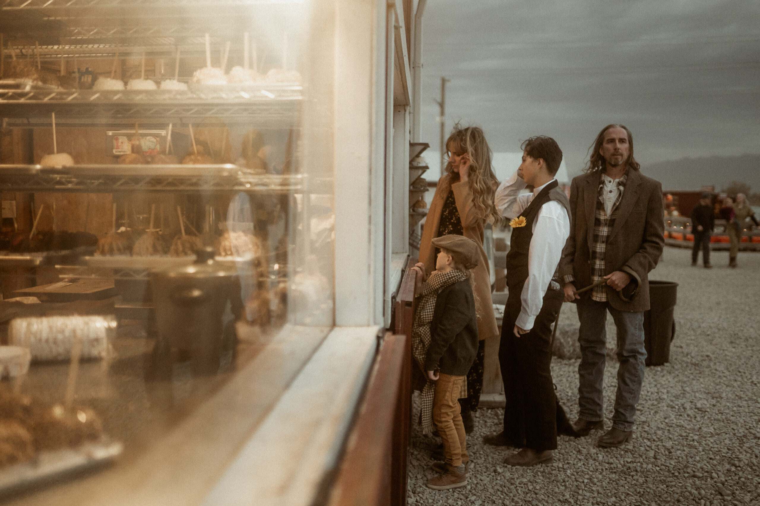 Family looking through store window